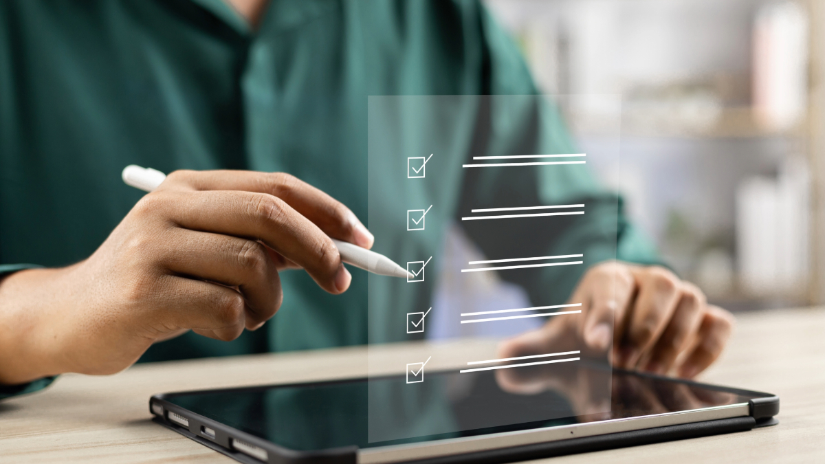 A marketer using Dotdigital’s email service provider (ESP) migration checklist on iPad, planning a smooth transition to the new platform.
